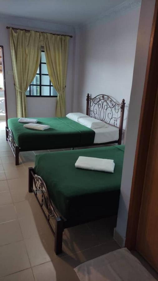 Kanza Beach Inn Marang Bagian luar foto